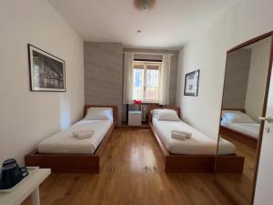 Łóżko lub łóżka w pokoju w obiekcie B&B Civico 40