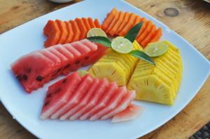 a plate of fruit and vegetables on a table at Wild Trails Yala by Suri in Yala