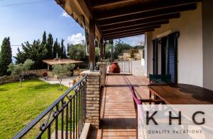 A balcony or terrace at Villa Harmony in Lourdata