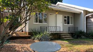 a house with a table in front of it at 35 on Fairview in Kloof