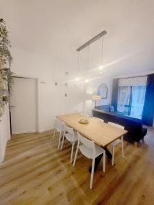 a dining room with a wooden table and chairs at Albufeira Old Town T3 with Balcony in Albufeira