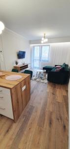 a living room with a couch and a table at Willa Matejki in Przemyśl +25 photos