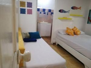 a room with two beds in a room at La casita de la playa in La Entrada