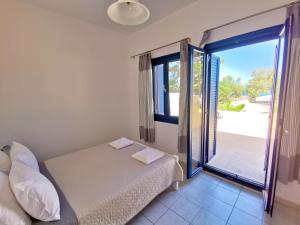 Posteľ alebo postele v izbe v ubytovaní Captain's Beach Apartments + 37 fotografií