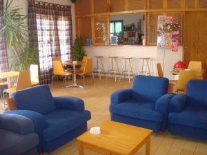 a living room filled with furniture and a couch at HI Alcoutim – Pousada de Juventude in Alcoutim