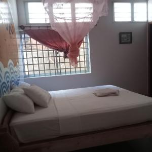 Nomad Guesthouse客房内的一张或多张床位