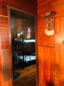 a door leading into a room with a bunk bed at Hub Backpackers Hangout in Coron