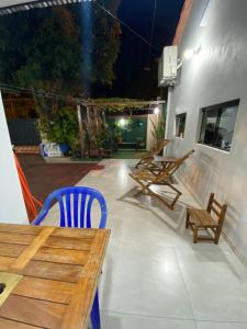 a patio with a wooden table and chairs on a building at POSADA DON CANDIDO in San Antonio