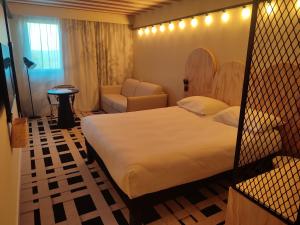 Ένα ή περισσότερα κρεβάτια σε δωμάτιο στο ibis Styles Montauban