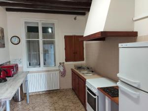 a kitchen with a sink and a counter top at Chez Robins in Trie-Château