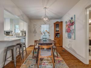 a kitchen and dining room with a table and chairs at The Charming Pecan Place! in Oklahoma City