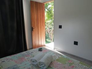 Ένα ή περισσότερα κρεβάτια σε δωμάτιο στο Loft na Mata