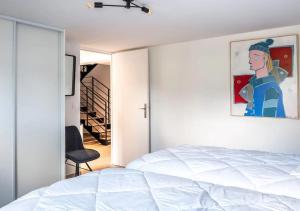 En eller flere senge i et værelse på VILLA LAURE PAIMPOL - Maison Front de mer