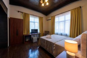 A bed or beds in a room at Casa Maria Hotel