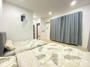 Postel nebo postele na pokoji v ubytování Home in Johor Bahru