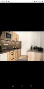 Kuchyňa alebo kuchynka v ubytovaní Appartement des cordeliers avec parking
