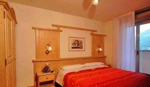Postel nebo postele na pokoji v ubytování Hotel Piancastello