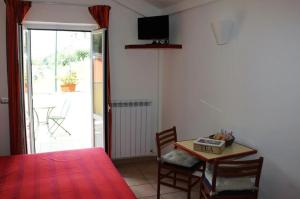 a room with a table and a table and a table and chairs at Hotel Villa Argentina in Riomaggiore