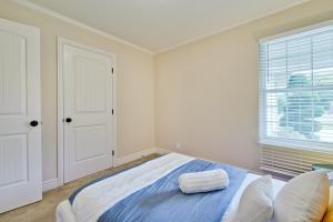 a white bedroom with a bed and a window at 私家花园后院 远程办公 in San Jose