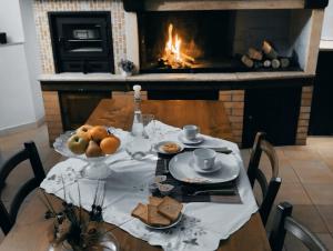 a table with food and a fireplace in a room at Casa vacanza Giovanni Salvatori in Orvieto Scalo