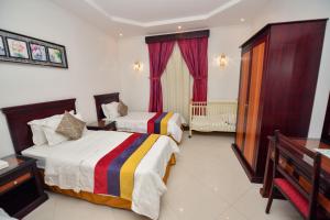 Postel nebo postele na pokoji v ubytování Aseel Alsharq Hotel + 37 fotografií