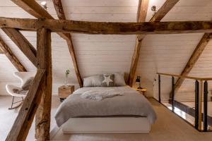 Säng eller sängar i ett rum på Gut Junkernhof