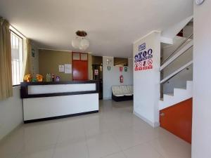 a kitchen and a living room with a staircase at Raissa Hotel in Ilo