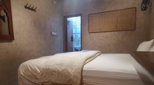 Postel nebo postele na pokoji v ubytování Durrat Al-Misfah Guest House