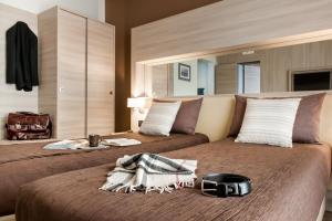 Postel nebo postele na pokoji v ubytování Hotel Trapani In