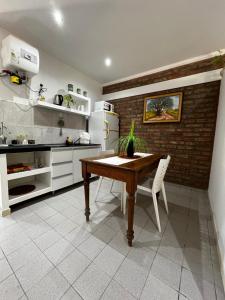 Een keuken of kitchenette bij La Quinta Departamento