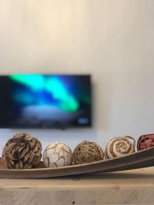 a tray of chocolates on a table in front of a tv at Superbe appartement centre ville proche des pistes in Morez