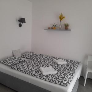 Posteľ alebo postele v izbe v ubytovaní Apartment Moravský Kras