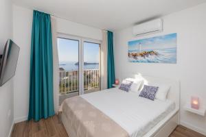 Voodi või voodid majutusasutuse Seabreeze Apartments Cavtat toas