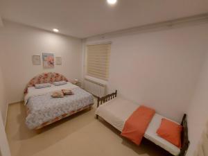 Ένα ή περισσότερα κρεβάτια σε δωμάτιο στο Apartman Pale Jahorina