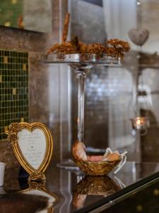 a glass table with a bowl of food and a heart on it at Villa Siveri - private swimming pool - air con in Figline Valdarno