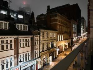a view of a city street at night at The Temple House Balcony Suite in Birmingham