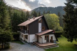 a small house in the middle of a forest at Chaty Daniela in Liptovský Ján