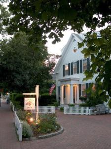 a large white house with a large window at Ashley Inn in Edgartown