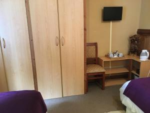 Ein Bett oder Betten in einem Zimmer der Unterkunft Merken Bed & Breakfast