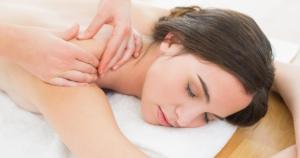 a woman is laying on a white massage at Hotel Dordéan Casona Boutique in Chachapoyas