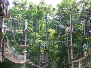 a playground in a park with people on the ropes at Gorgeous Ski On/Off 2 BR Sleeps 8 Jiminy-Must See Luxury in Hancock