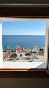 a view of the ocean from a window at El amante Altea in Altea