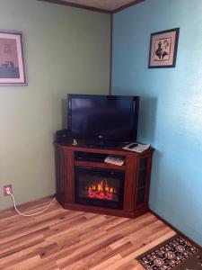 TV a/nebo společenská místnost v ubytování KMJ Rentals
