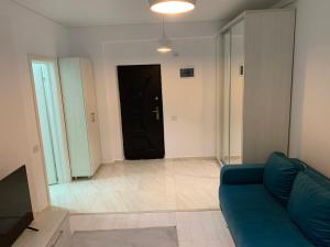 Khu vực ghế ngồi tại Apartament cu regim hotelier Militari Residence Helen