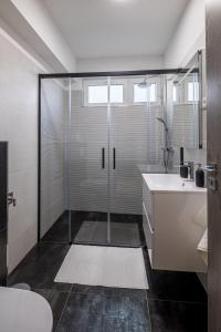 a bathroom with a shower and a toilet and a sink at Balatonic Relax in Zamárdi