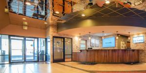 a lobby of a building with a reception desk at The Federal Hotel Downtown Carson City, Ascend Hotel Collection in Carson City