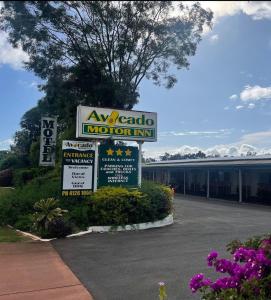 a motel sign in front of a motor inn at Avocado Motor Inn in Childers
