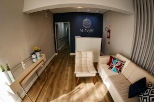 a living room with a couch and a table at Pousada Al Mare in Balneário Camboriú +63 photos