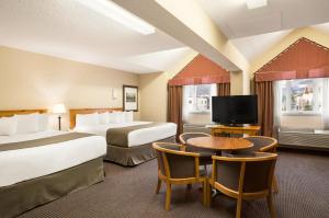 A television and/or entertainment centre at Canmore Inn & Suites
