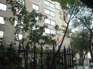a black fence in front of a building at Hotel Bristol in Mexico City